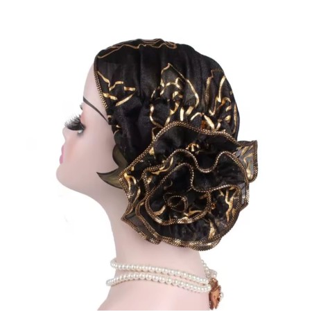 Turbante tela elásticada , color rosado o negro con flores doradas y una flor grande de adorno
